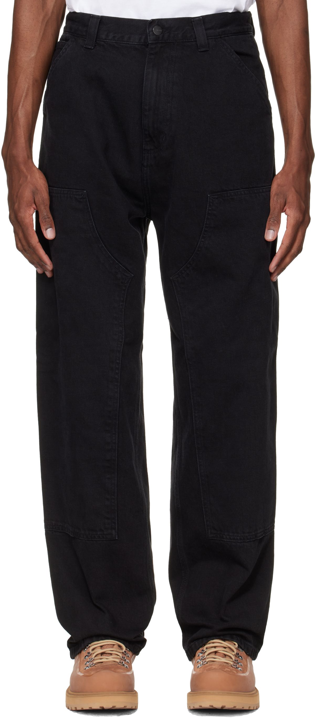 Carhartt Work In Progress Aaron Jeans in black, front view showcasing the tapered fit and utilitarian construction