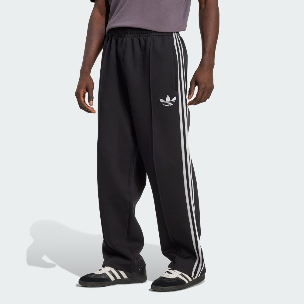 adidas Adicolor Spacer Baggy Track Pants in relaxed oversized silhouette with tapered cuffs and drawstring waist