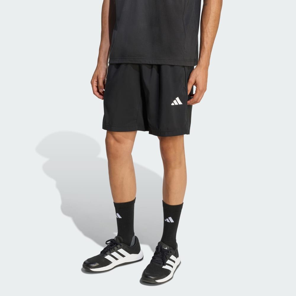 adidas Workout Essentials Base Woven Short in neutral colorway, displayed flat lay showing woven construction and minimalist design