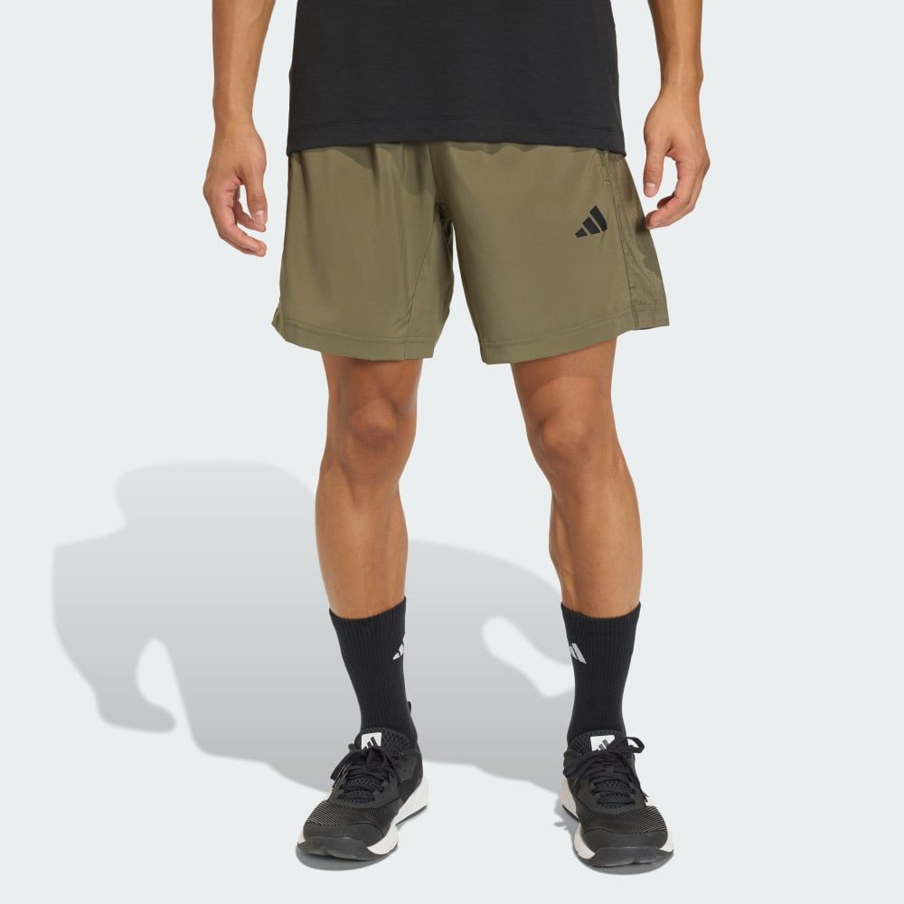 adidas Workout Essentials Base Woven Short in neutral colorway, displayed flat lay showing woven fabric construction and minimalist design