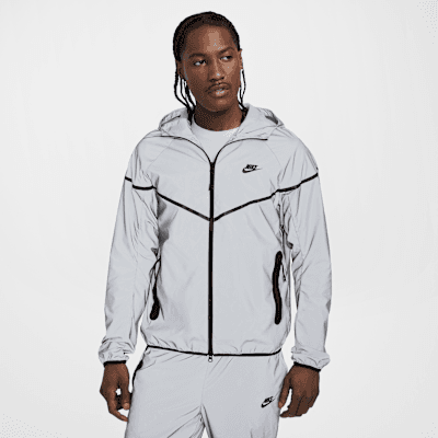 Nike Tech Men's Woven Reflective Jacket in Reflect Silver and Black, featuring lightweight ripstop construction and reflective overlay detailing