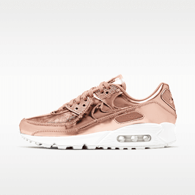 Nike Air Max 90 SP in Rose Gold, Metallic Red Bronze, and White—featuring visible Air Max heel unit and layered Swoosh construction