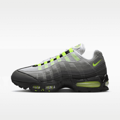 Nike Air Max 95 OG in Black/Cool Grey/Neon Yellow colorway featuring visible Max Air cushioning and TPU ribbed overlays